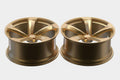 Pair of gold alloy car wheels with five-spoke design on a white background