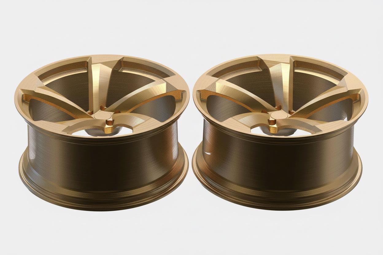 Pair of gold alloy car wheels with five-spoke design on a white background