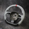 Custom steering wheel for 2005-2011 Audi A3, A4, A5, A6, Q5, Q7, S4, S5 by Exclusive Steering, close-up of leather and control buttons.