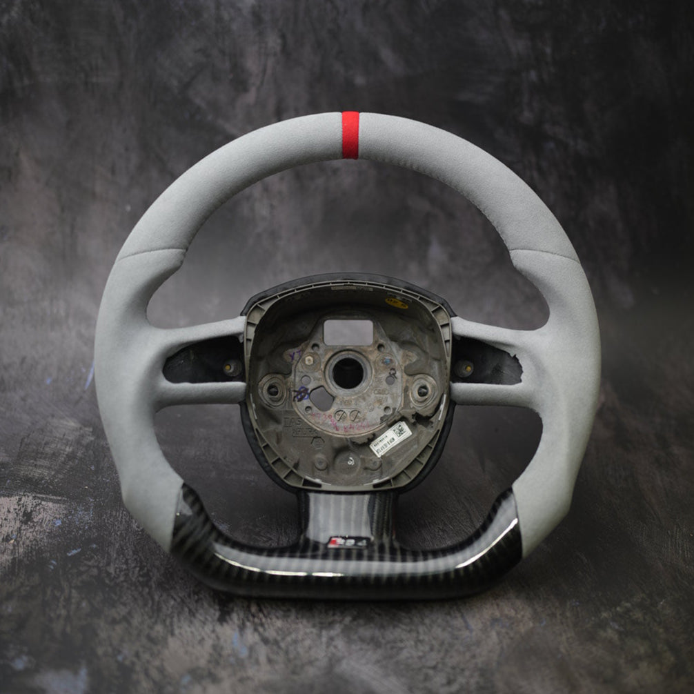 Audi A3 A4 A5 A6 Q5 Q7 S4 S5 custom steering wheel by Exclusive Steering, featuring a black leather grip and silver accents.