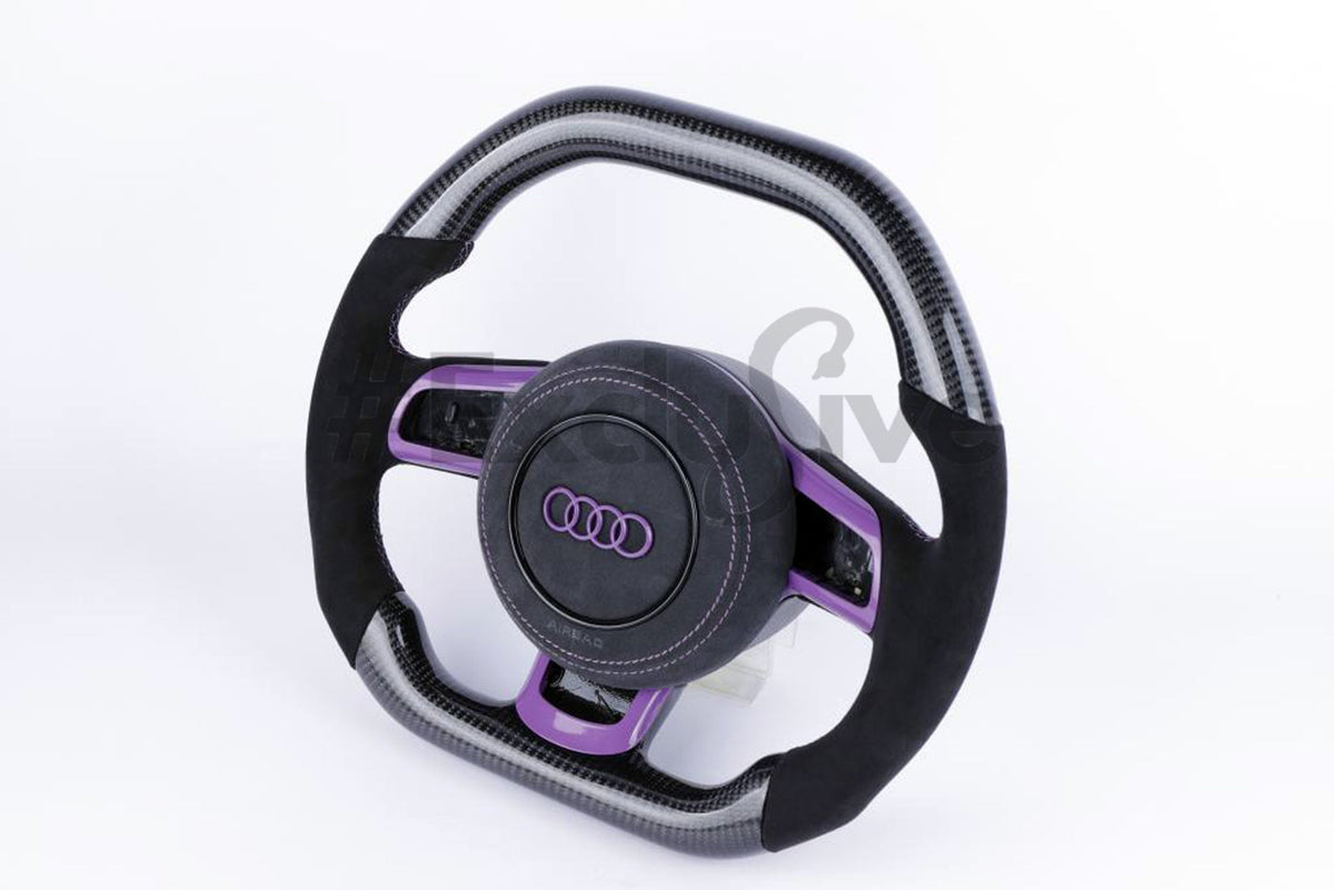 Custom Audi R8 and TT steering wheel by Exclusive Steering, featuring sleek black leather and sporty design for 2008-2015 models