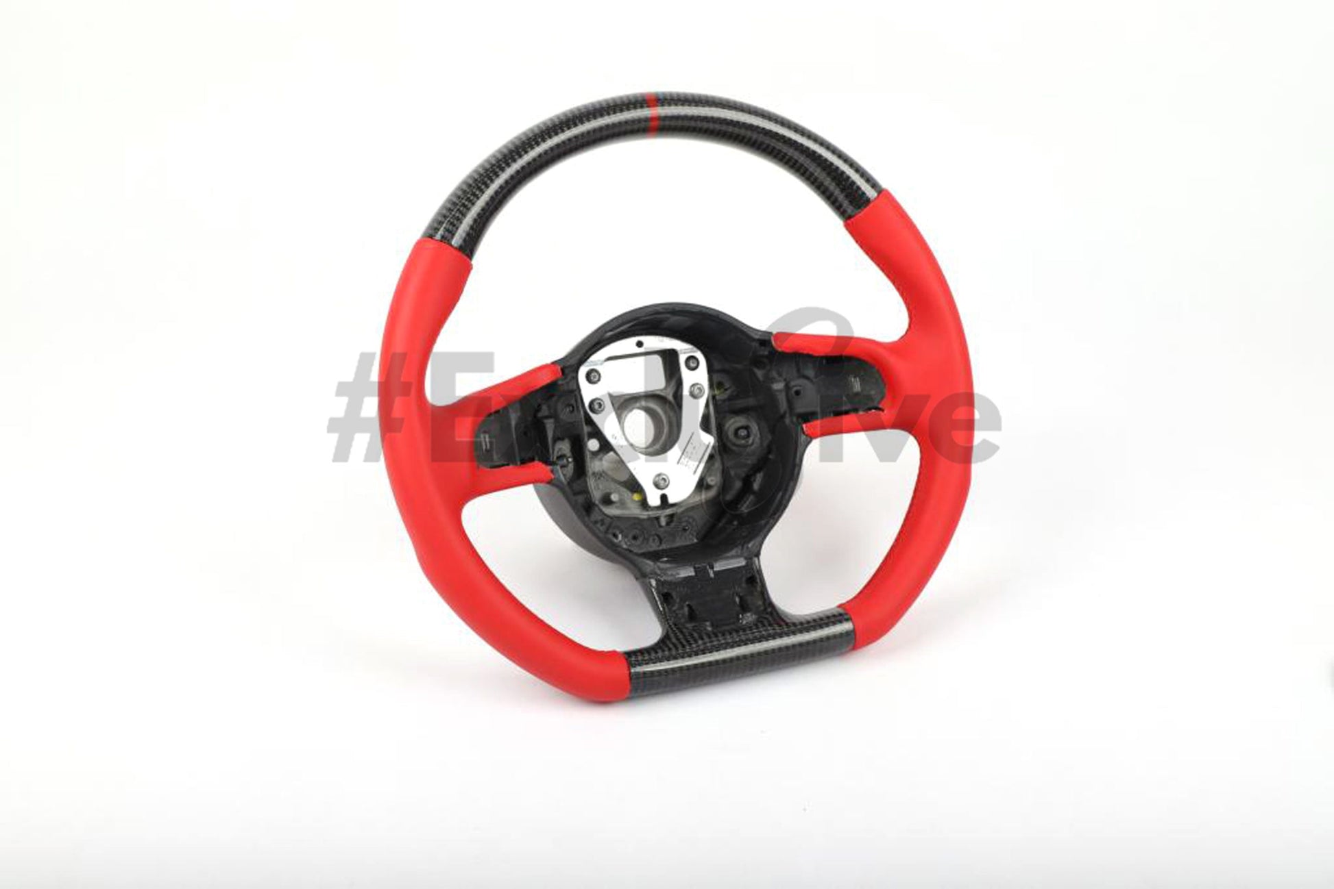 Custom Audi R8 and TT steering wheel by Exclusive Steering, featuring a sleek black leather design with polished accents.