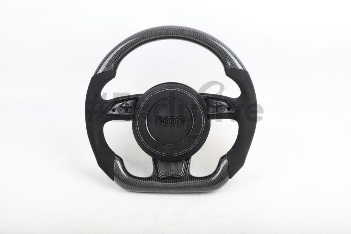 Custom Audi R8 and TT steering wheel by Exclusive Steering, black leather with silver accents, designed for 2008-2015 models.