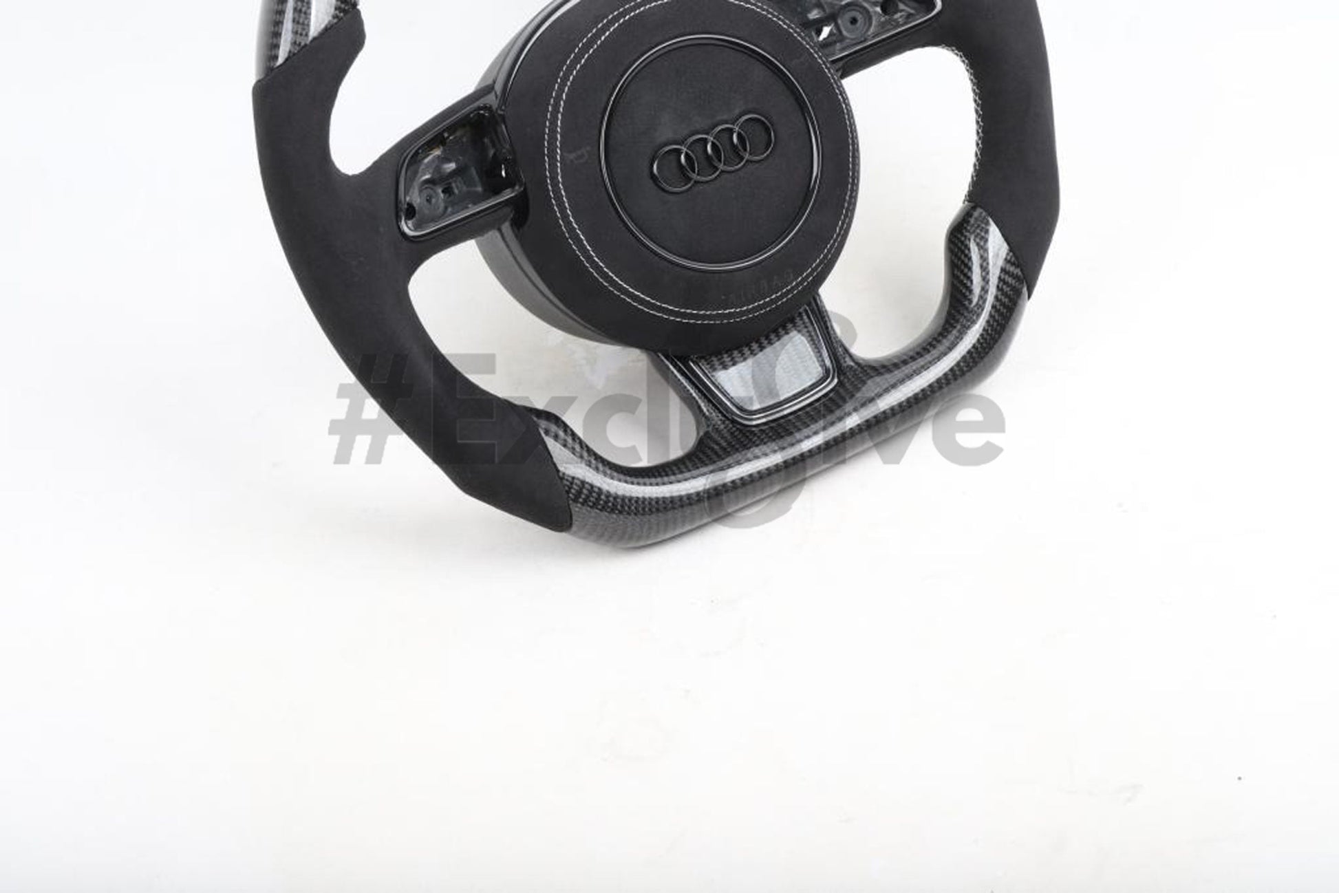 Custom Audi R8 and TT steering wheel by Exclusive Steering, high-quality black leather with silver accents, designed for 2008-2015 models.