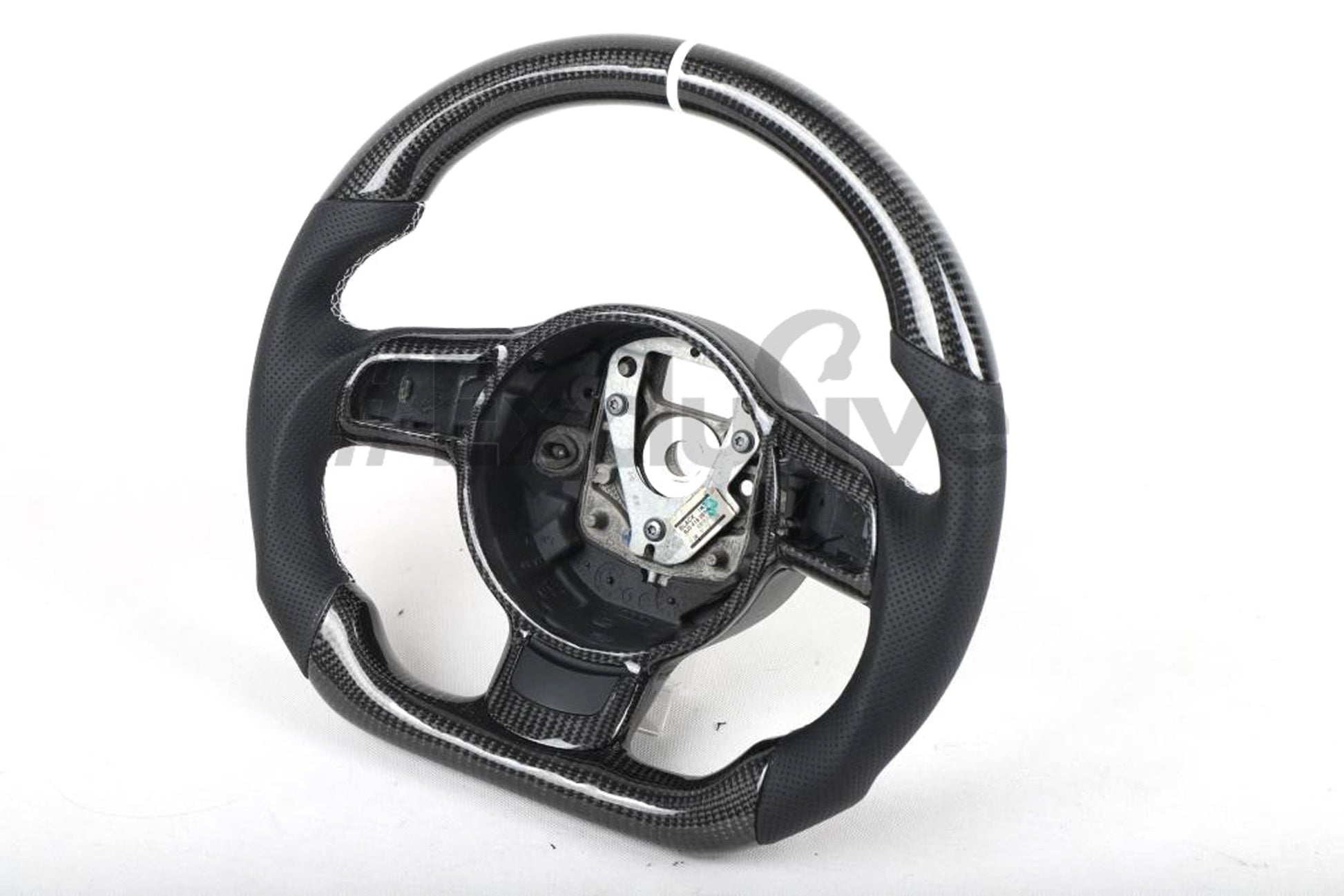 Custom Audi R8 and TT steering wheel by Exclusive Steering, black leather with silver accents, mounted on a car dashboard.