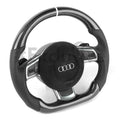 Custom Audi R8 and TT steering wheel by Exclusive Steering, featuring a sleek black leather and carbon fiber design.