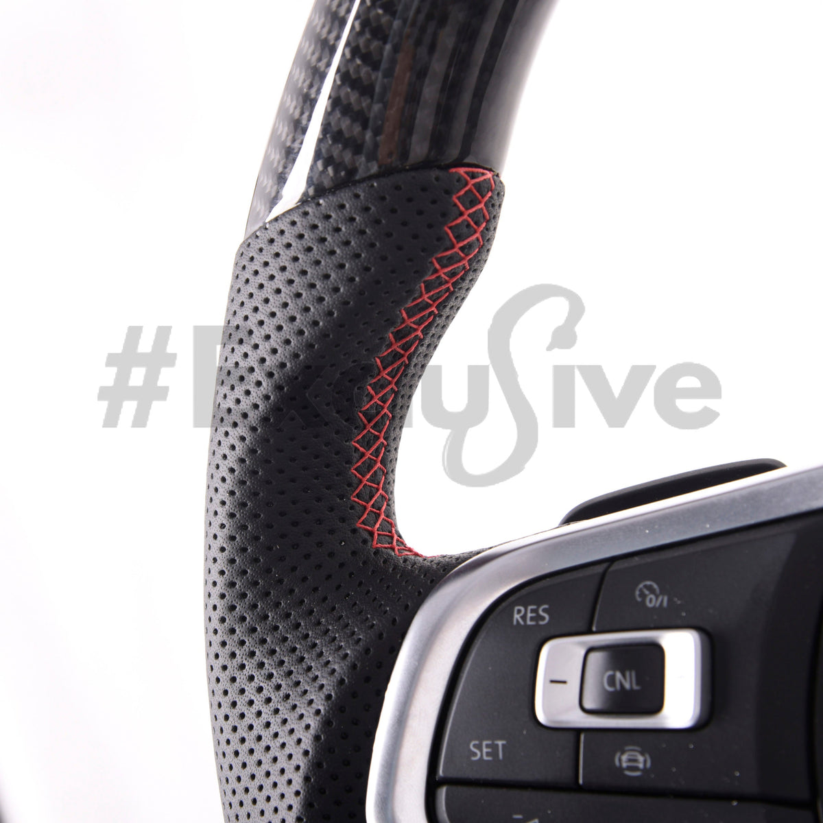 Volkswagen Golf MK7 GTI & R custom steering wheel by Exclusive Steering, black leather with silver accents, close-up view.