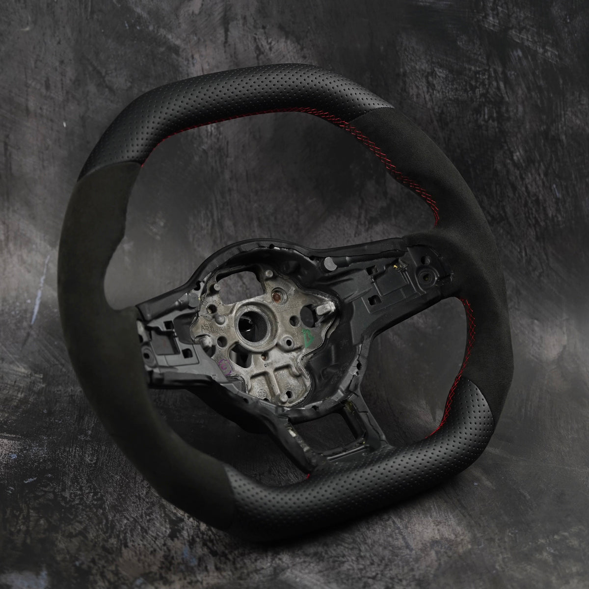 Volkswagen Golf MK7 GTI & R custom steering wheel by Exclusive Steering, black leather with red stitching and ergonomic design.
