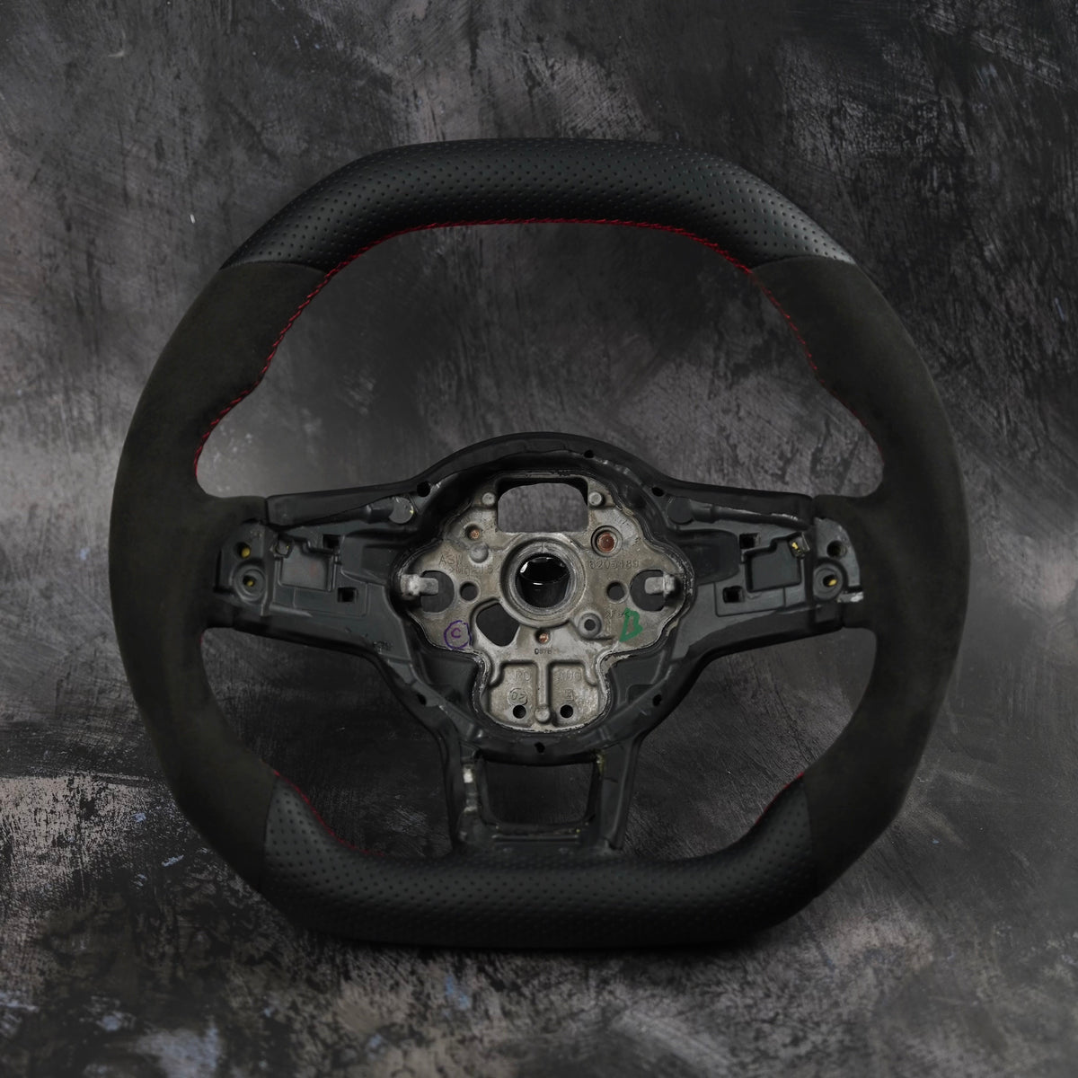 Volkswagen Golf MK7 GTI & R custom steering wheel by Exclusive Steering, featuring a sporty design and premium leather details.