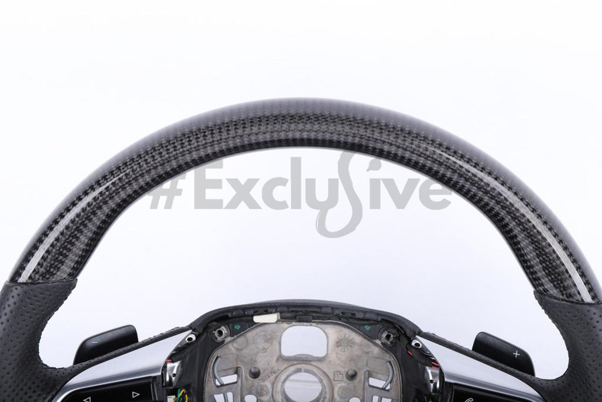 Custom Audi A8/E-tron steering wheel by Exclusive Steering, black leather with silver accents, detailed close-up of the steering wheel surface.