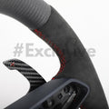 Custom black leather Audi R8 and TT steering wheel by Exclusive Steering with detailed stitching and brand logo in the center.