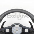 Custom Audi R8 and TT steering wheel by Exclusive Steering, featuring a sleek black leather design with silver accents.