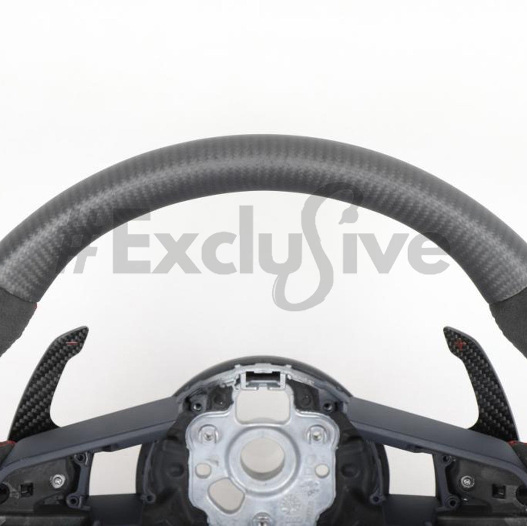 Custom Audi R8 and TT steering wheel by Exclusive Steering, featuring a sleek black leather design with silver accents.
