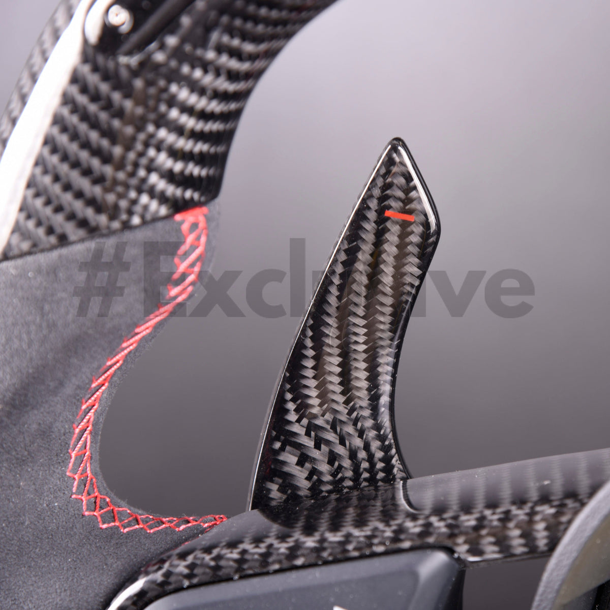 Custom Audi R8 and TT steering wheel by Exclusive Steering, featuring premium leather and detailed craftsmanship.