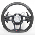 Audi R8 and TT custom steering wheel by Exclusive Steering, close-up view of premium leather and detailed craftsmanship.