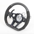 Audi R8 and TT steering wheel by Exclusive Steering, custom black leather with silver accents, detailed stitching and sporty design.