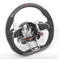 Custom Audi R8/TT steering wheel by Exclusive Steering, featuring a sleek black leather design with silver accents.