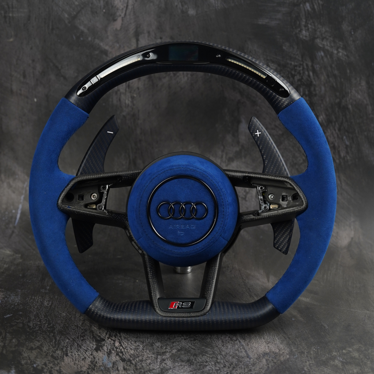 Audi R8 and TT 2016-2023 custom steering wheel by Exclusive Steering, close-up of the sporty leather and metal design