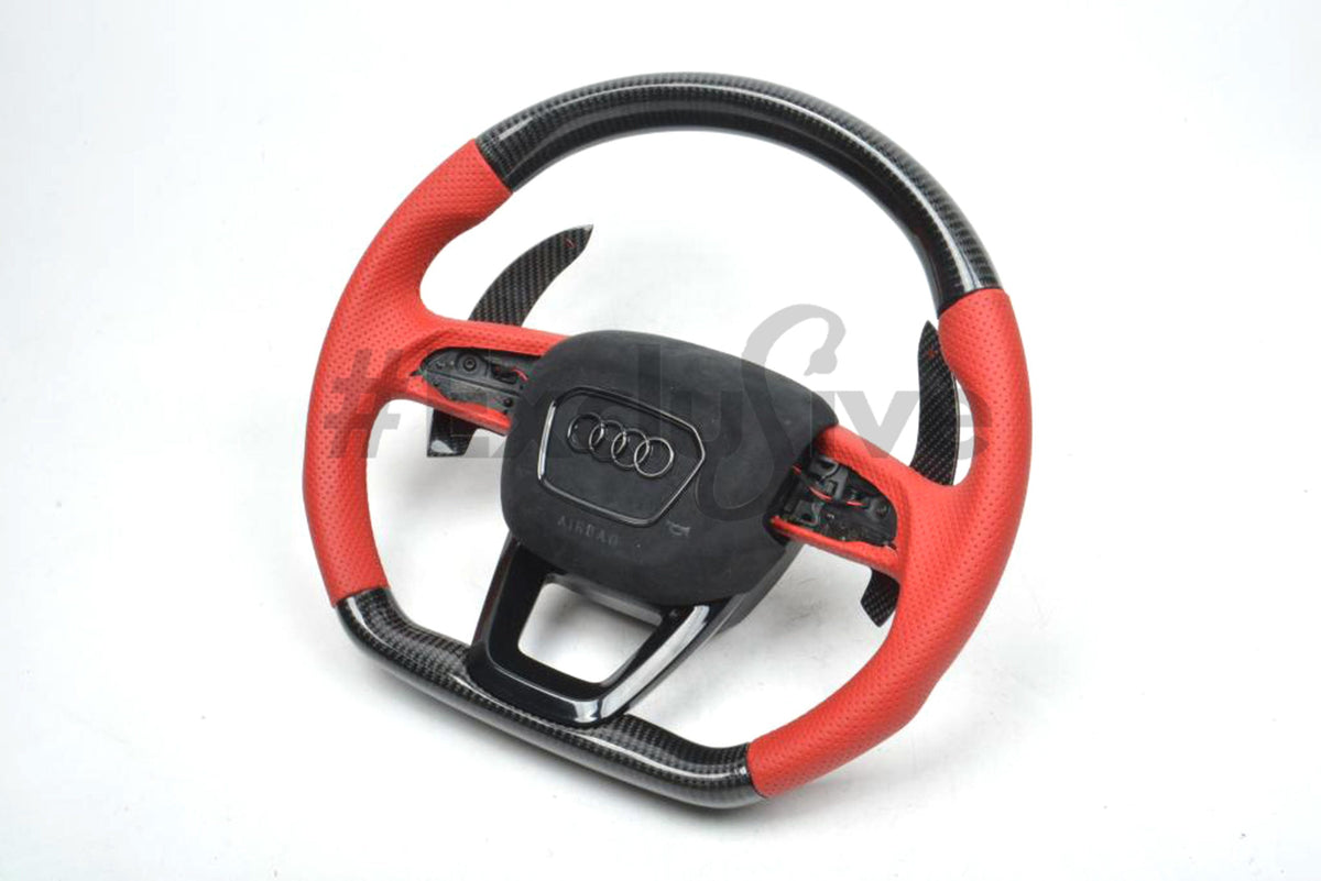 Custom Audi steering wheel for Q3, Q5, Q7, Q8, SQ5, and SQ7 by Exclusive Steering, showing a sleek black leather design with silver accents.