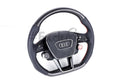Custom Audi A6, S6, RS6, A7, S7, RS7, C8 steering wheel by Exclusive Steering, showing a sleek leather and metal design.