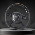 Custom Audi A3, A4, A5, A6, and Q7 steering wheel by Exclusive Steering, showing a close-up of the premium leather and detailed craftsmanship.