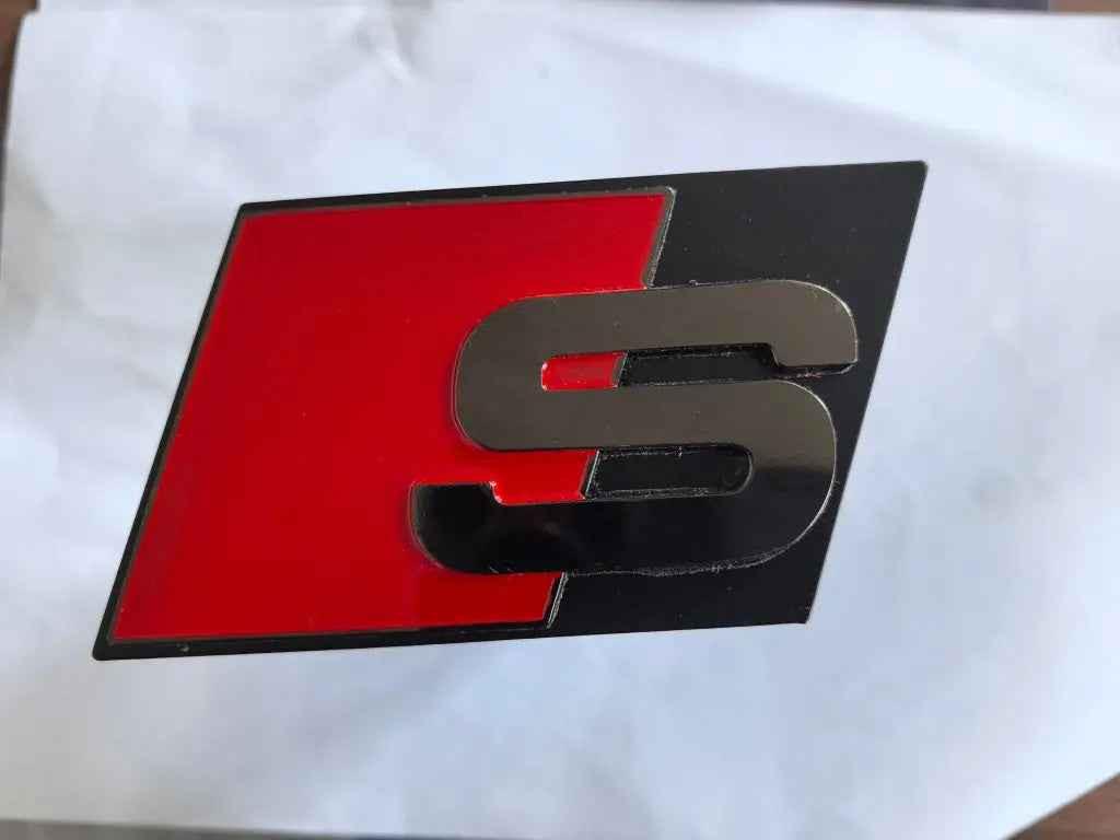 Audi Sport "S" and "RS" custom trailer hitch by Vorsprung Autowerk installed on a vehicle, showcasing durable, high-performance towing equipment.