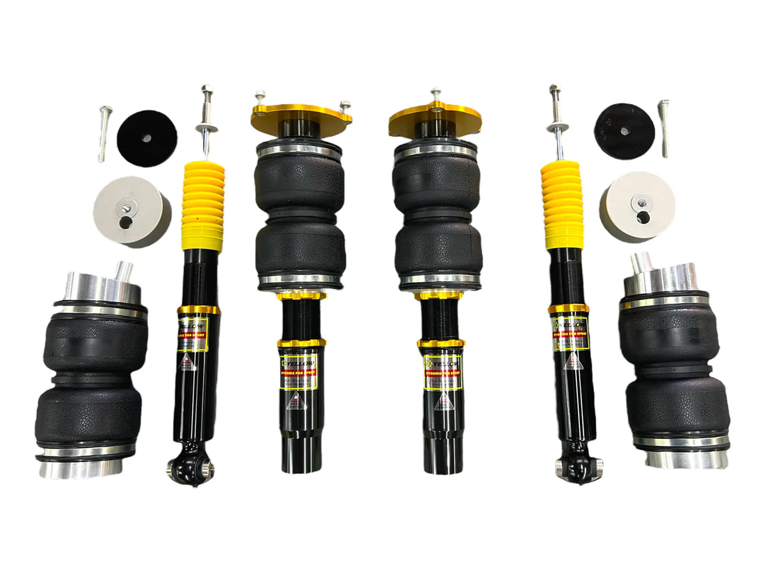 High-performance Audi air suspension kit with black and yellow adjustable struts and hardware