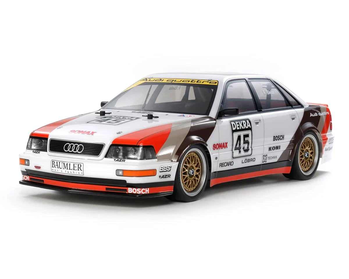 TAMIYA 58682-60A 1991 Audi V8 Touring 1/10 scale 4WD electric RC car kit with detailed body and TT-02 chassis, assembled for display.