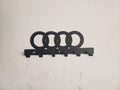Steel wall-mounted Audi logo keychain rack by Martin Metalwork LLC, designed for organizing keys and accessories in a stylish euro car organizer.