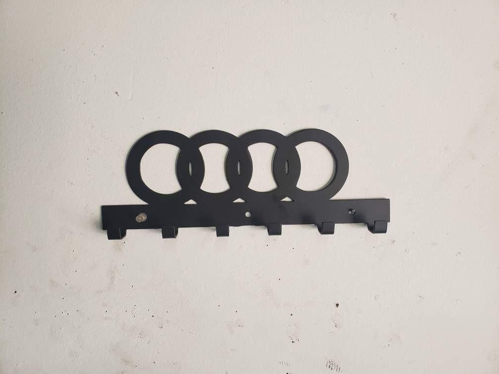 Steel wall-mounted Audi logo keychain rack by Martin Metalwork LLC, designed for organizing keys and accessories in a stylish euro car organizer.