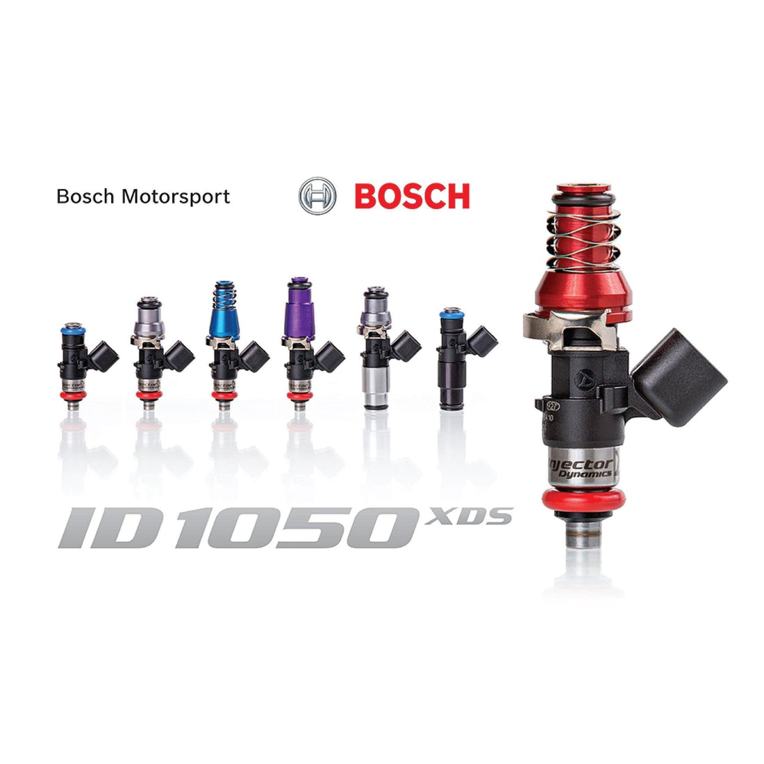 Set of four MOTIV Injector Dynamics ID1050XDS fuel injectors with detailed nozzle tips and metal bodies for automotive performance.