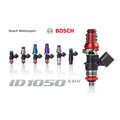 Set of four MOTIV Injector Dynamics ID1050XDS fuel injectors with detailed nozzle tips and metal bodies for automotive performance.