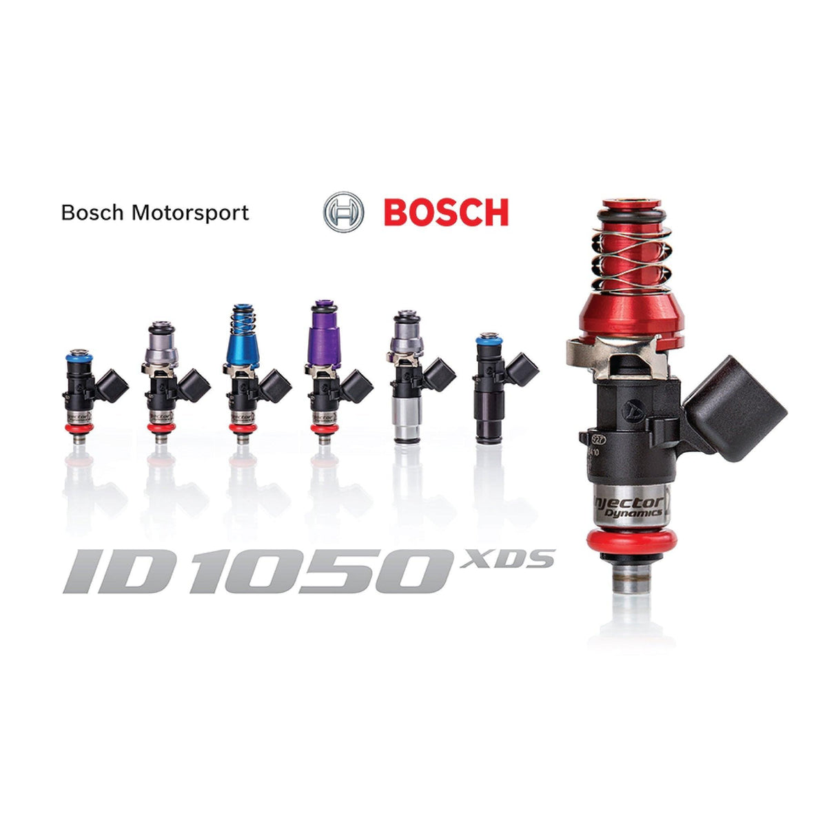 Set of four MOTIV Injector Dynamics ID1050XDS fuel injectors with detailed nozzle tips and metal bodies for automotive performance.