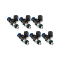 Set of four MOTIV Injector Dynamics ID1050XDS fuel injectors with metal bodies and electrical connectors.