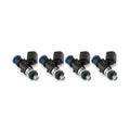 Set of four MOTIV Injector Dynamics ID1050XDS fuel injectors with metal connectors and precise spray patterns.