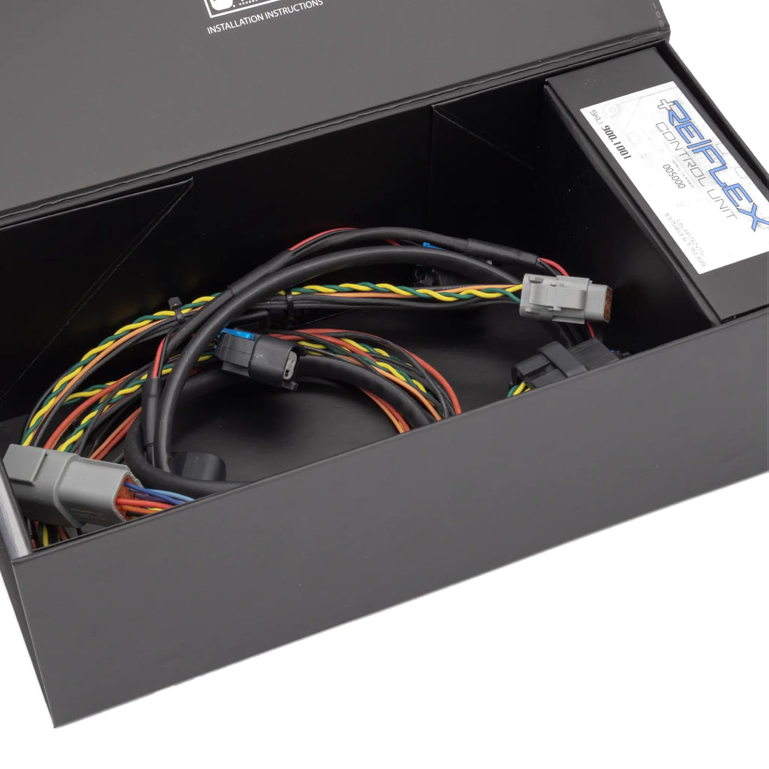 Motiv ReFlex+ Advanced I/O Integration for Inline-4 engines, showing the sleek universal inline-4 module with electronic connections.