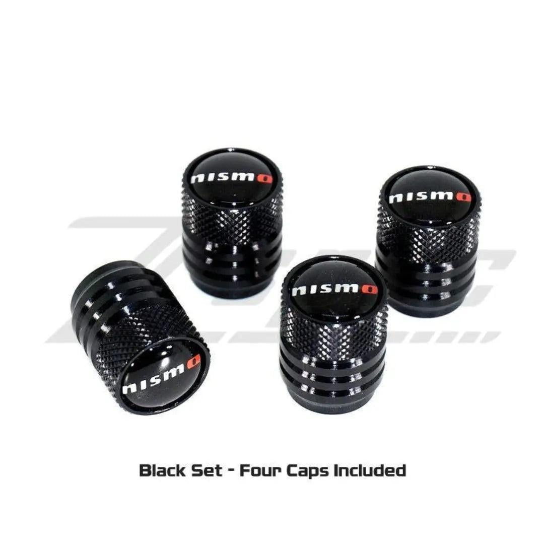 NISMO Nissan tire valve stem cap set in black, featuring sleek, durable caps for vehicle wheel valves.