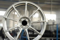 Set of Vorsprung Autowerk forged VA-003 style wheels with a sleek silver finish, shown on a vehicle for a sporty look.