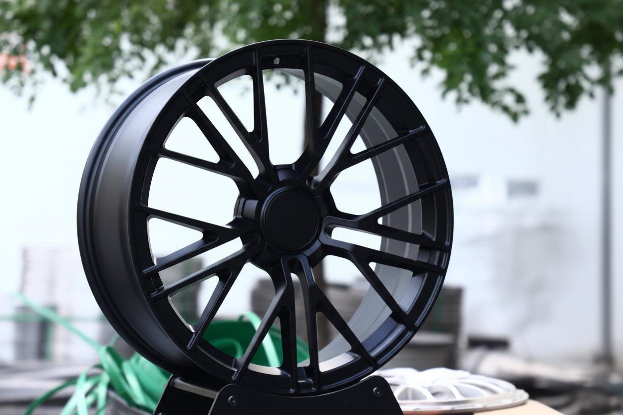 Set of Vorsprung Forged VA-009 Style Wheels by Vorsprung Autowerk on a vehicle, showcasing sleek, black alloy design.