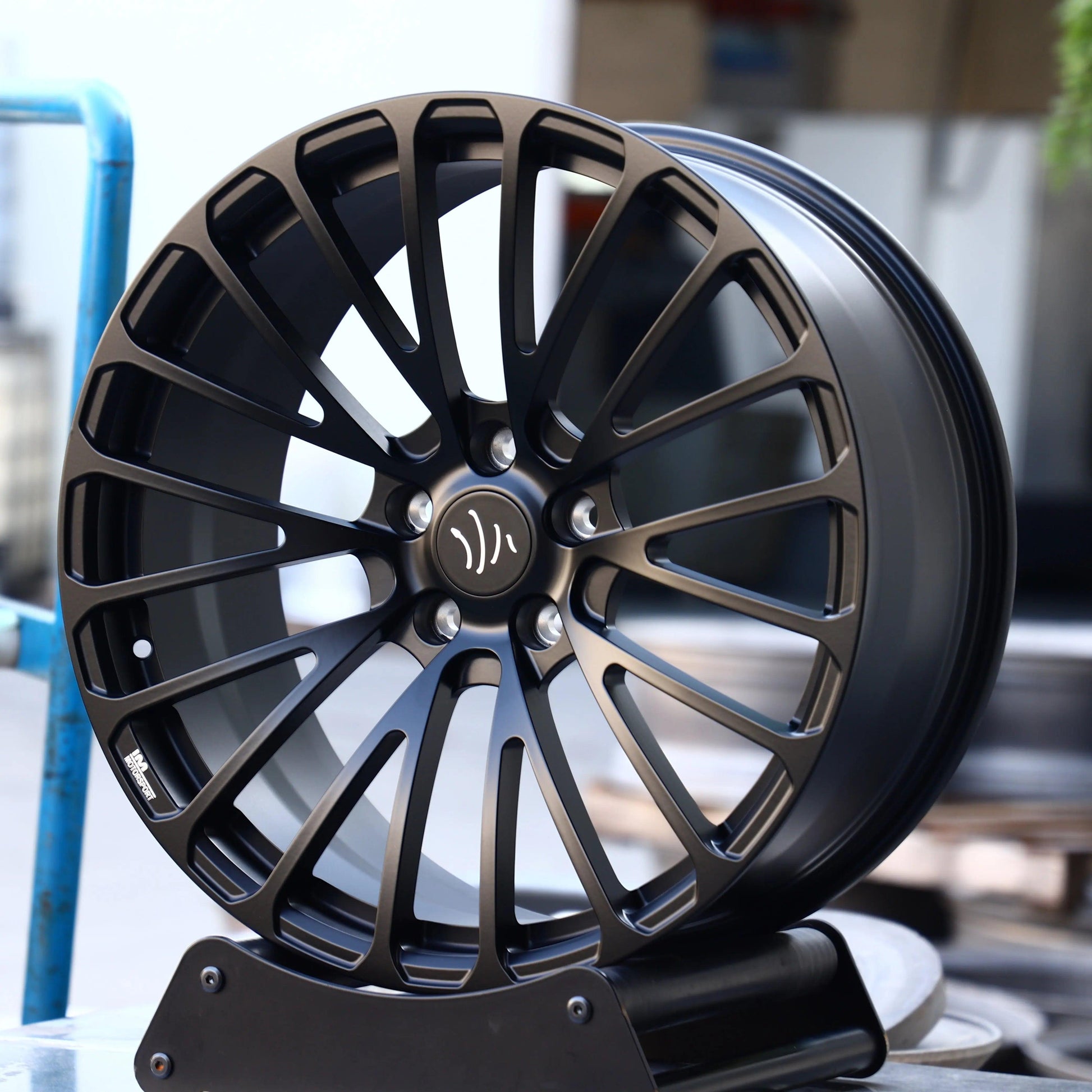 Set of Vorsprung Forged VA-010 style wheels by Vorsprung Autowerk, featuring sleek multi-spoke design on a standard vehicle.