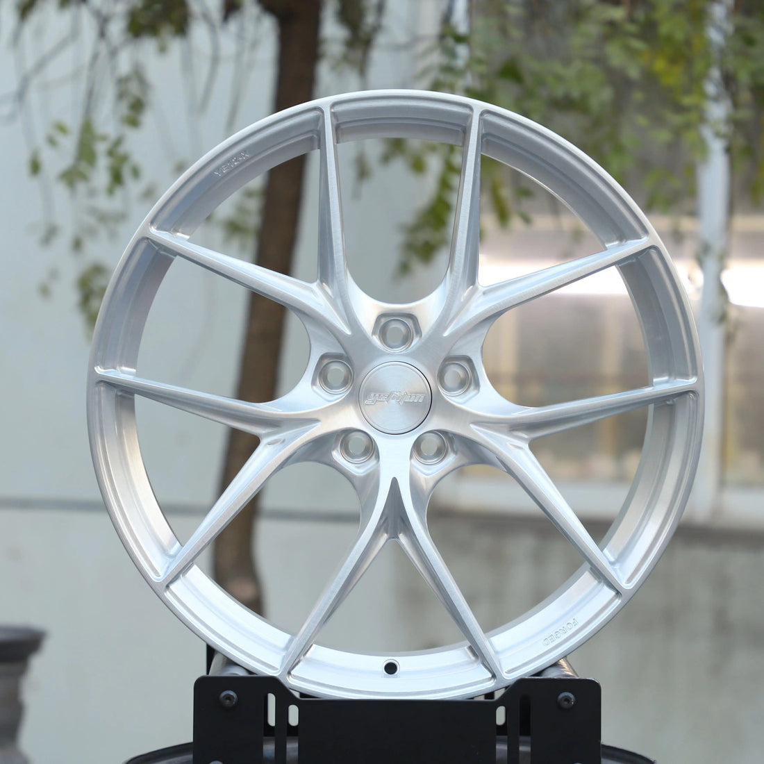 Set of Vorsprung forged VA-014 style wheels by Vorsprung Autowerk, showcasing a sleek, multi-spoke design on a vehicle.