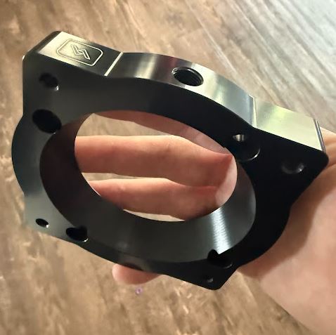 Vorsprung Autowerk 84mm billet throttle body upgrade adapter for Audi 3.0 EA837 supercharged engine, with ported supercharger opening.