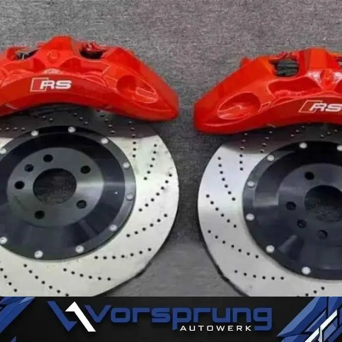 Red RS brake calipers and drilled brake rotors for Audi performance upgrade