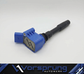 Blue and black Audi performance ignition coil with Vorsprung Autowerk branding for enhanced engine power and handling.