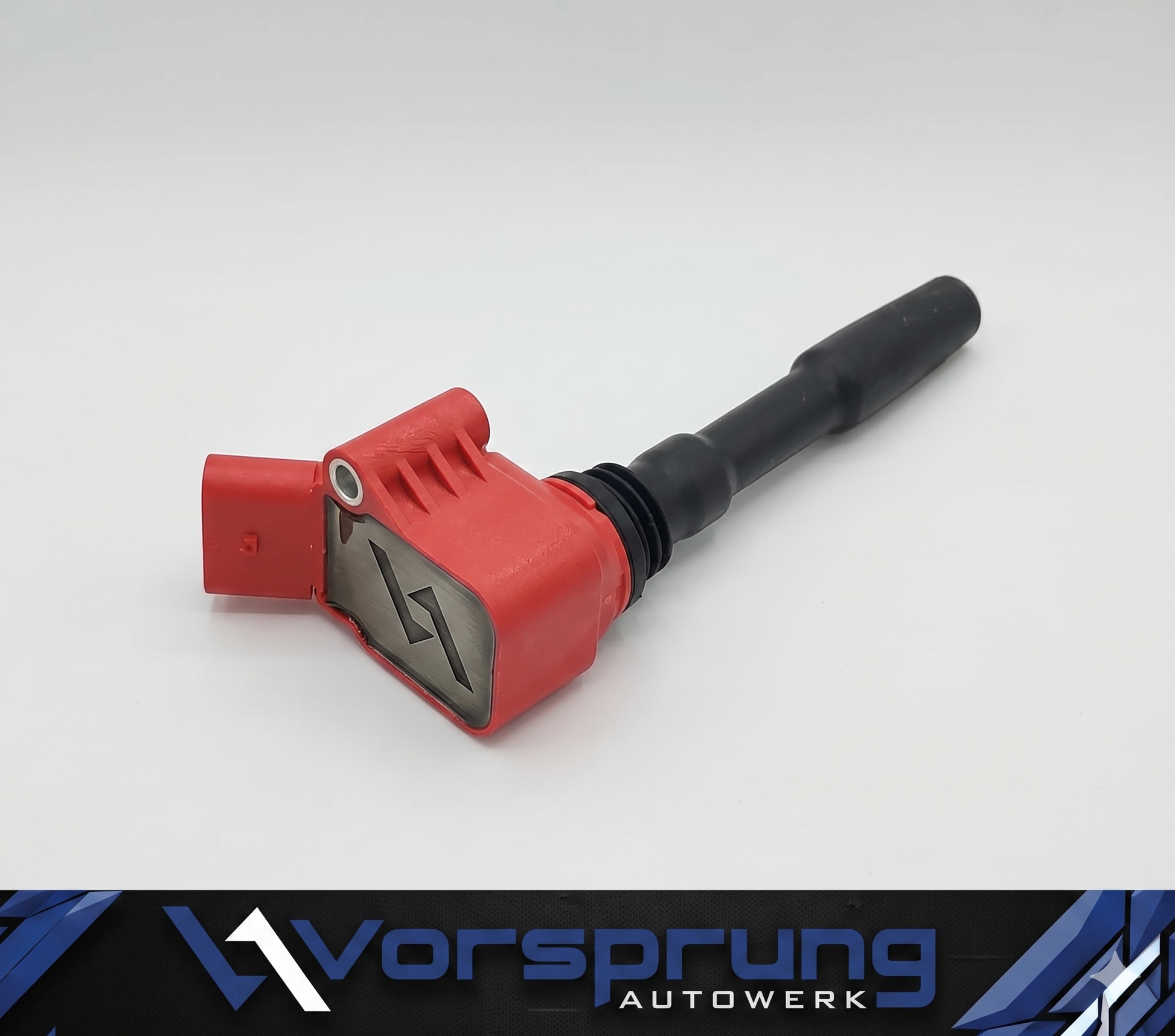 Red and black performance ignition coil for Audi, featuring a branded metal plate and sleek design.
