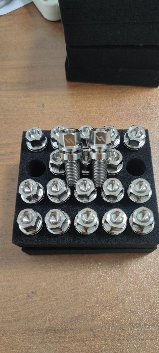 Silver Audi titanium ball seat wheel lug kit with four lock lug nuts and tool by Vorsprung Autowerk