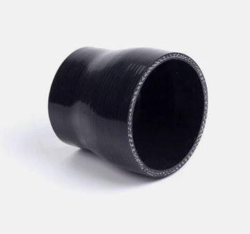 Vorsprung Autowerk intake coupler attached to a car's throttle body, showcasing a durable rubber connection for engine performance.