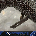 Closeup of textured heat-shielded Audi 3.0 supercharged test pipe with mounting bracket