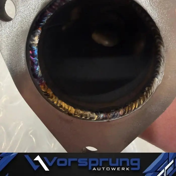 Close-up of stainless steel test pipe with precision welds for Audi 3.0T engine upgrade