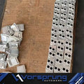 Set of machined aluminum engine parts for Audi 3.0T V6, EA837, arranged on a wooden surface.